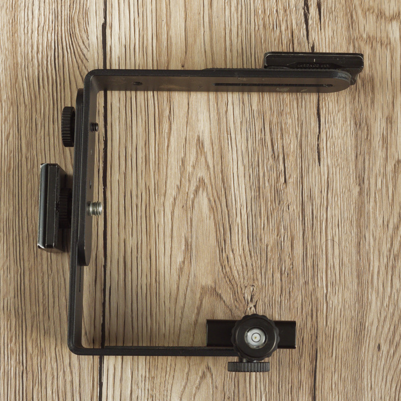 Photo of a home-made bracket to hold a camera in the correct orientation when used on a tripod with the centre column inverted. 